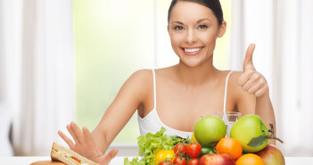 woman with fruits rejecting junk food
