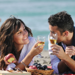 dating-picnic-couple-on-beach-shutterstock_64974040