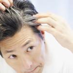 photolibrary_rf_photo_of_man_looking_at_gray_hair_thumb